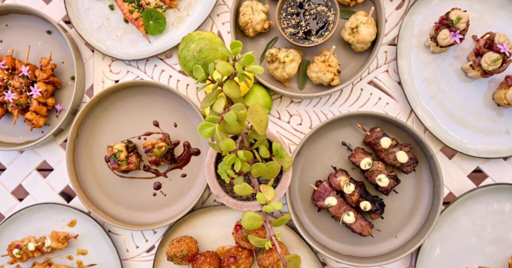 Various plates of food on a table