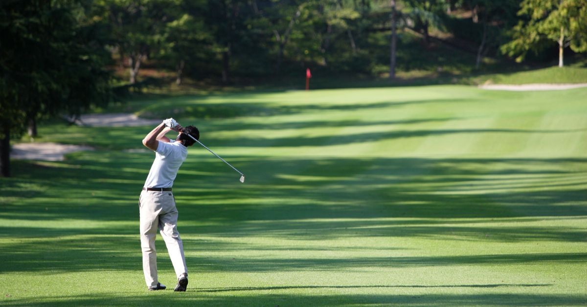 Vredenburg Golf Club - Man on a the golfing green hitting a ball