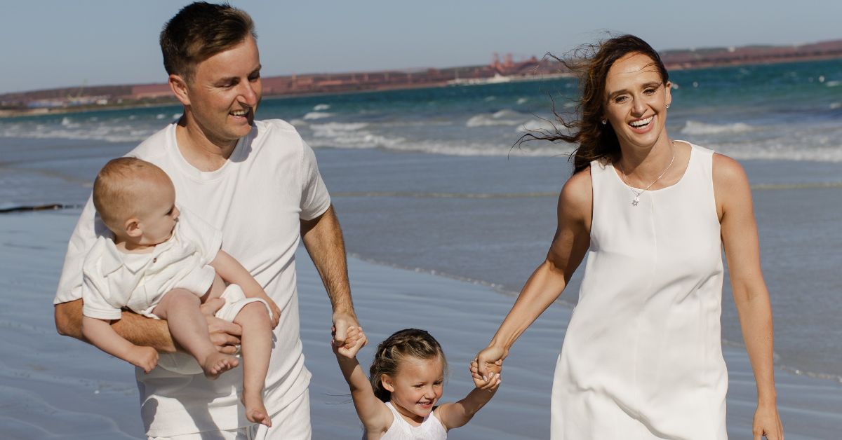A family walking on the beach
