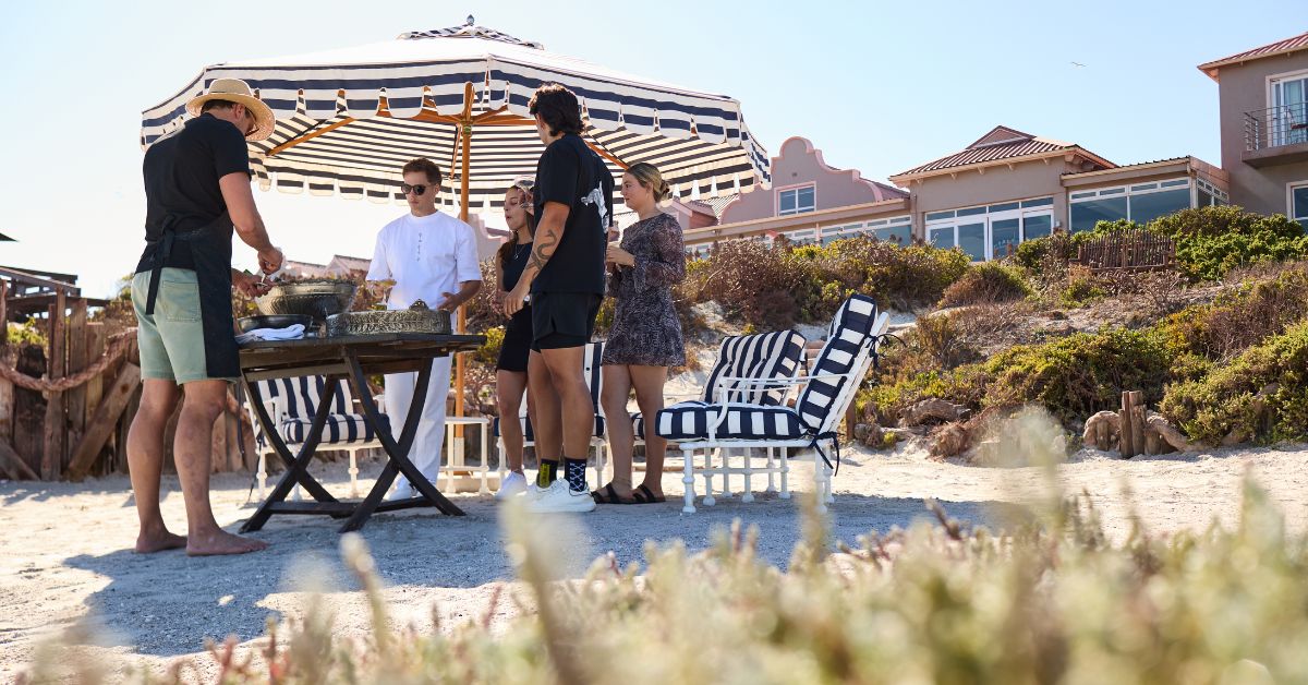 Guests enjoying lunch on the beach at Blue Bay Lodge 