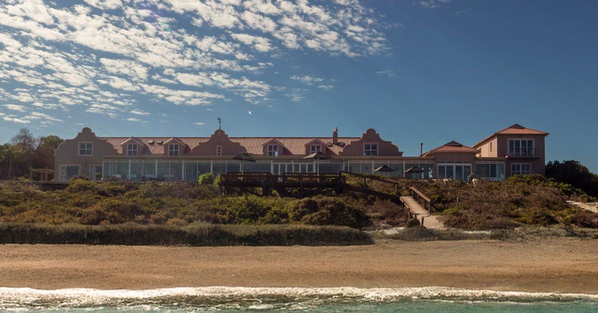 Front view of Blue Bay Lodge from the ocean