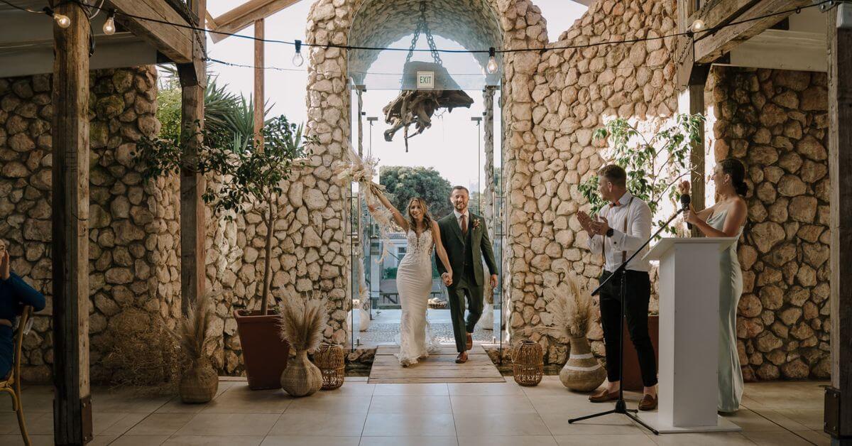 Newly married couple walking down the hallway at Blue Bay Lodge