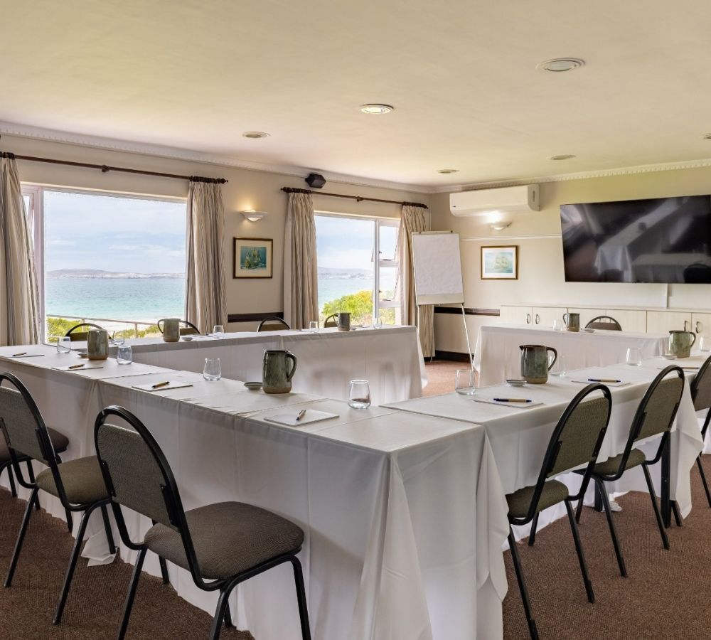 A modern conference room at Blue Bay Lodge with the Ocean in the distance